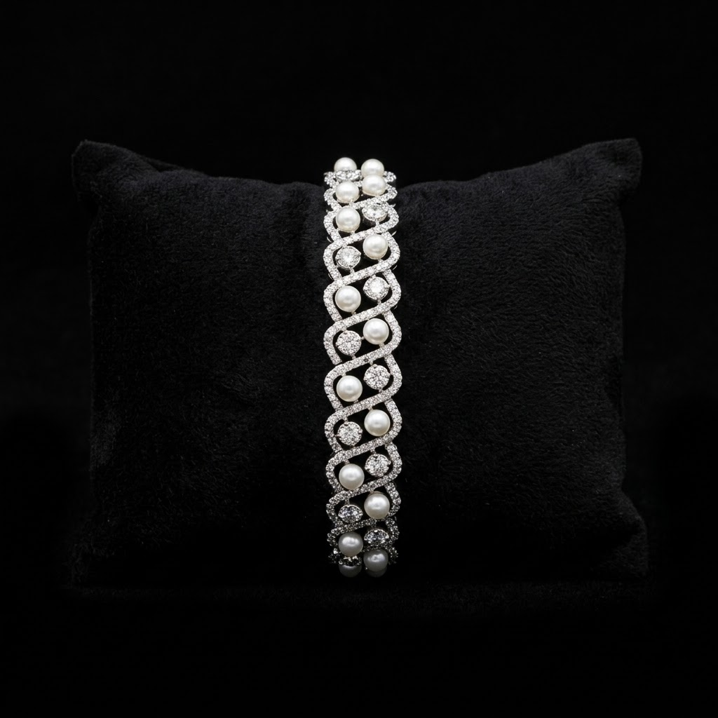 Pearlora AD Pearl Designer Silver Bracelet with AD stones and white pearls, silver-tone designer bracelet by ENAVA for women.