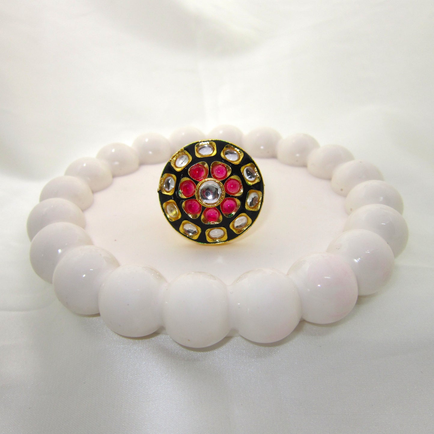 Ruhani Noir Ethnic & Traditional Kundan Black Golden Ring by Enava featuring white kundan stones, ruby pink accents, black meenakari, gold plating, adjustable statement ring for weddings, festive occasions, and traditional ethnic jewellery.