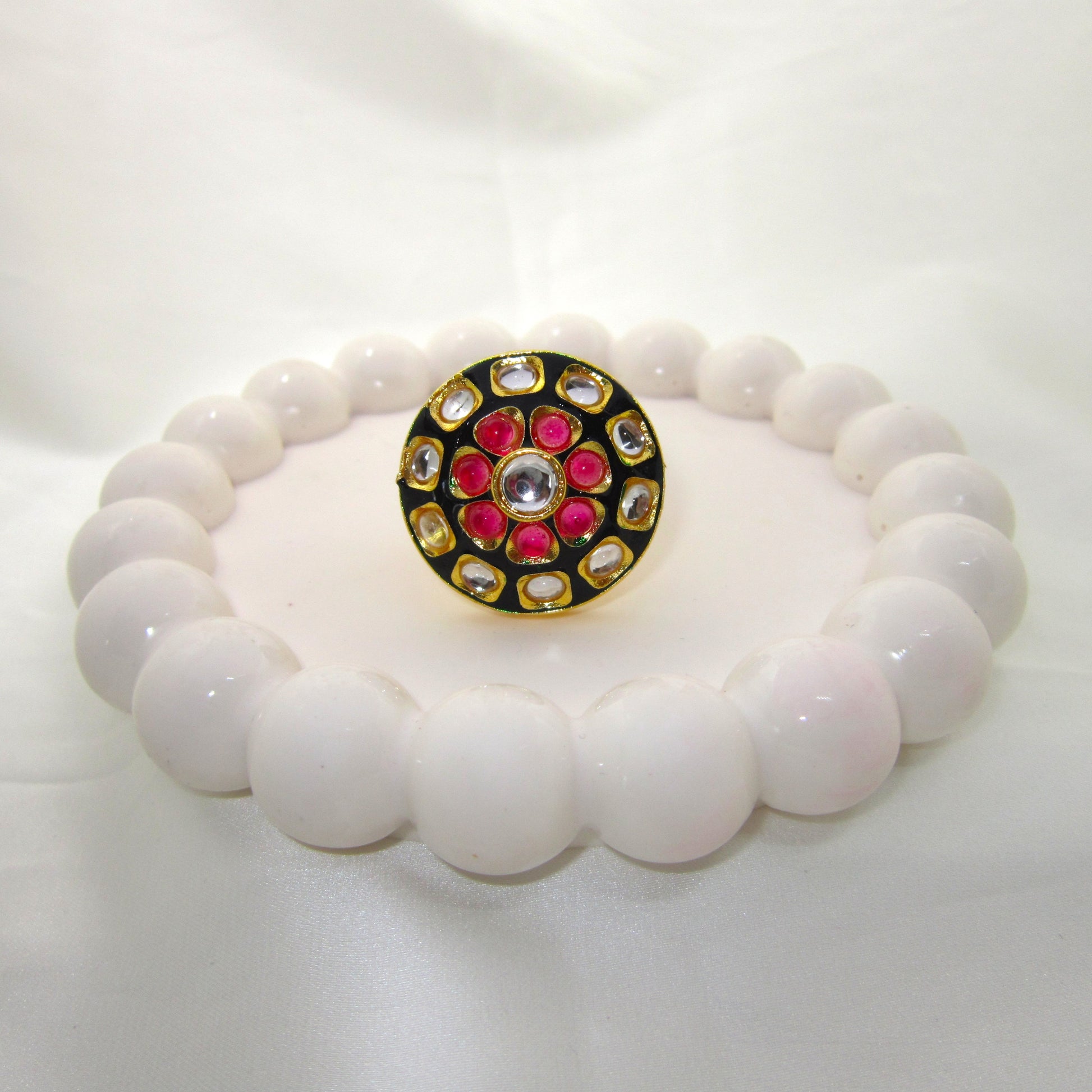 Ruhani Noir Ethnic & Traditional Kundan Black Golden Ring by Enava featuring white kundan stones, ruby pink accents, black meenakari, gold plating, adjustable statement ring for weddings, festive occasions, and traditional ethnic jewellery.