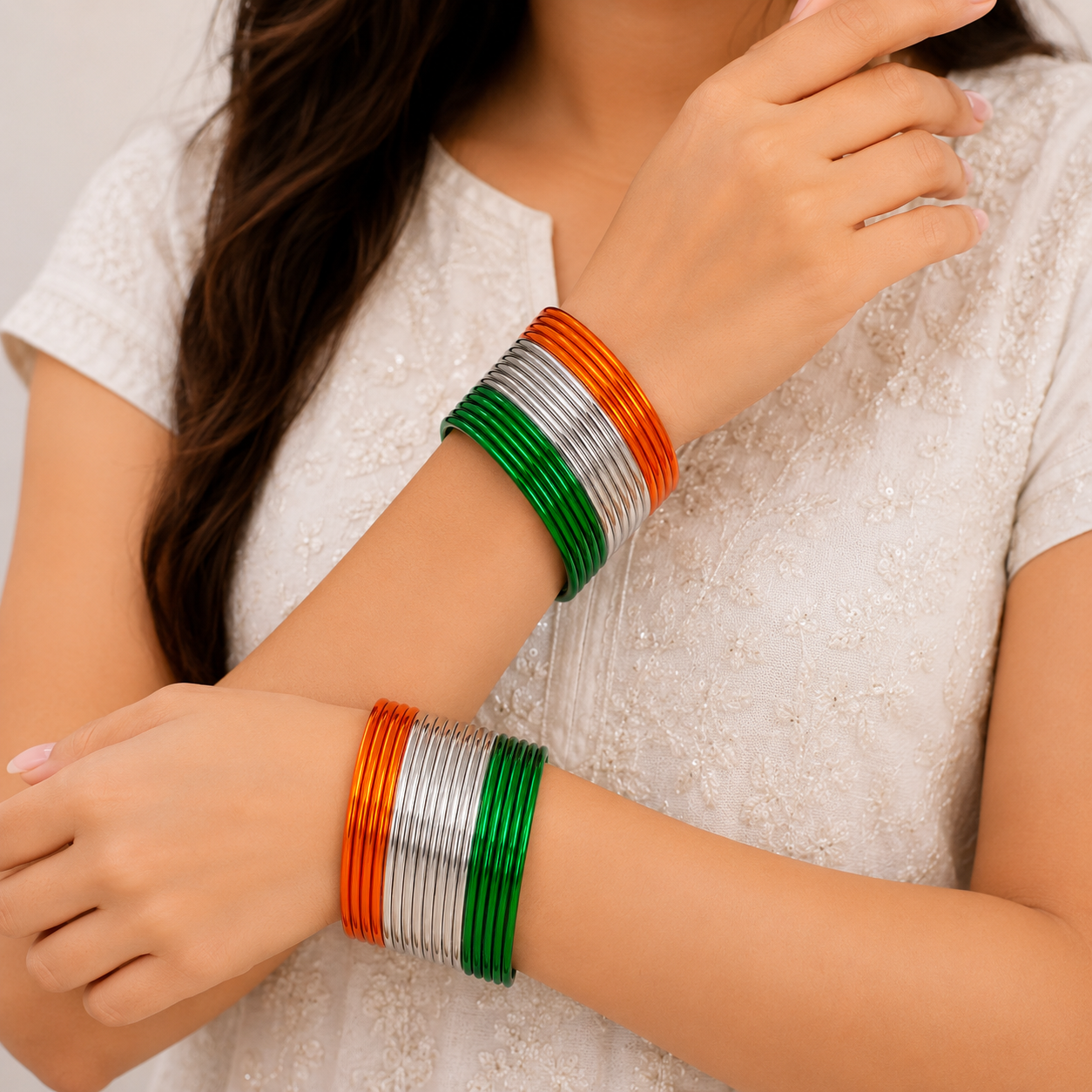 Saffron Trio Glossy Metal Bangles by Enava featuring a premium set of 24 glossy aluminium bangles in saffron, white and green tricolour finish, lightweight waterproof bangles ideal for Independence Day celebrations, patriotic events, festive occasions and ethnic wear.