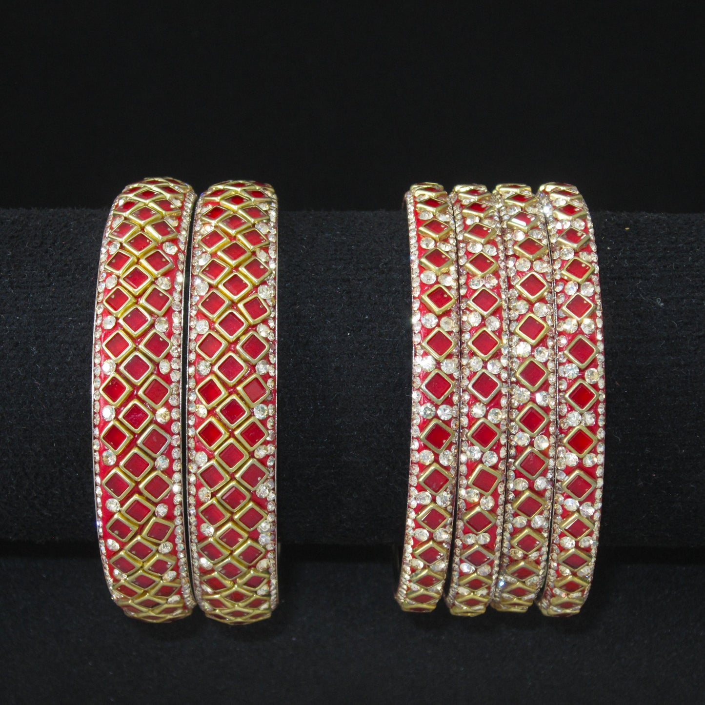 Sitara Red Festive Bangle Set with 2 kada bangles and 4 side bangles featuring vibrant red detailing, golden latticework and sparkling stones by ENAVA