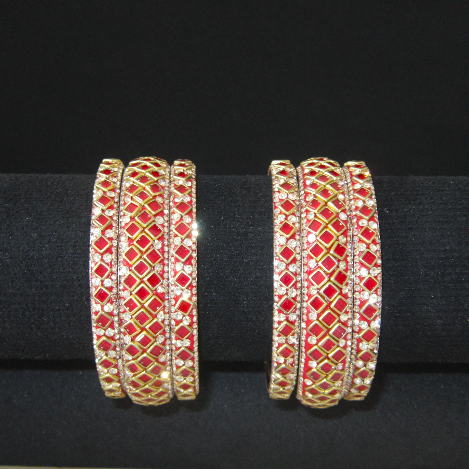 Sitara Red Festive Bangle Set with 2 kada bangles and 4 side bangles featuring vibrant red detailing, golden latticework and sparkling stones by ENAVA