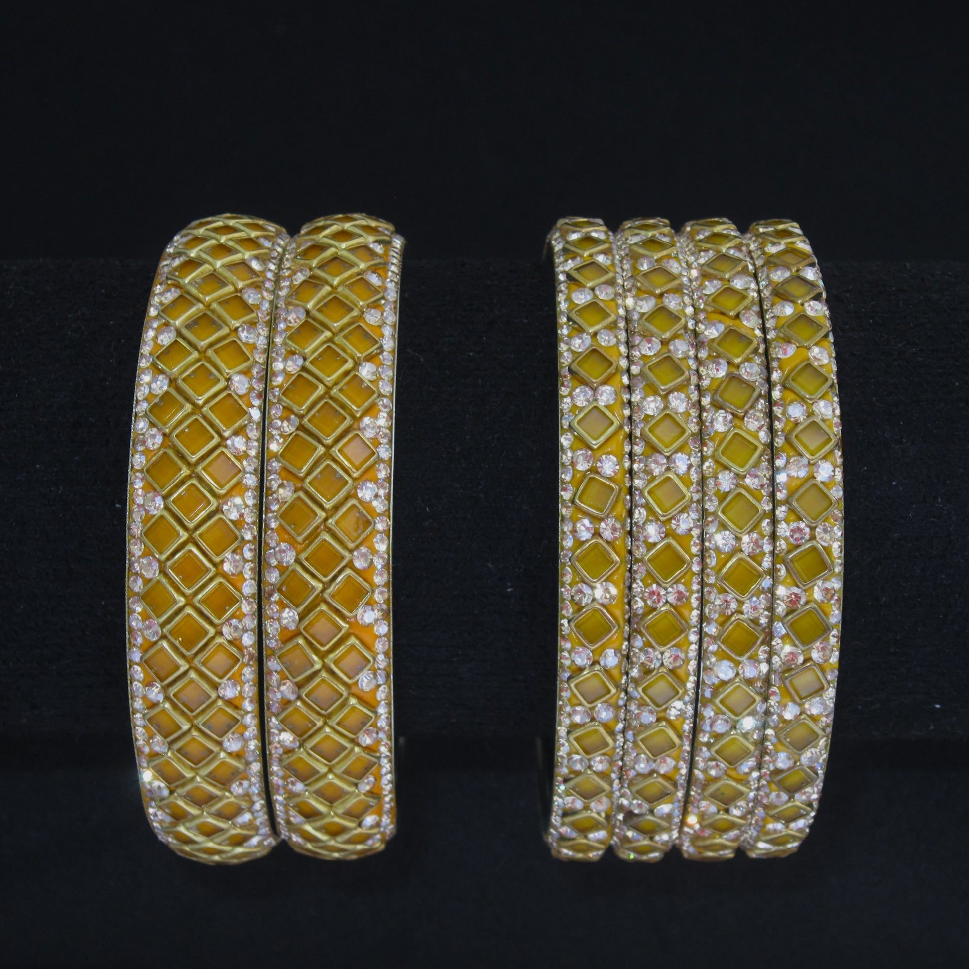 Sitara Yellow Festive Bangle Set with 2 kada bangles and 4 side bangles featuring yellow detailing, golden latticework and sparkling stones by ENAVA