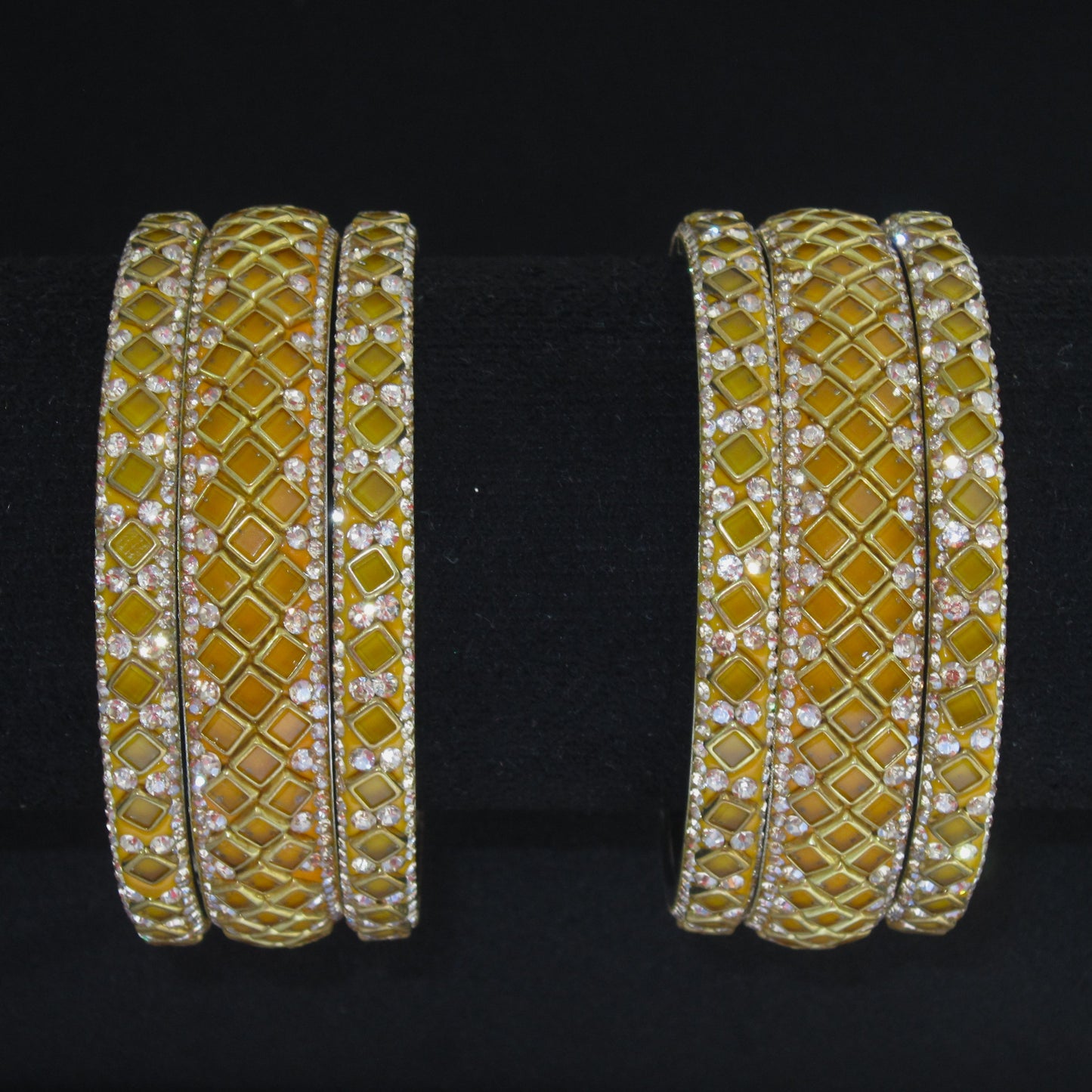 Sitara Yellow Festive Bangle Set with 2 kada bangles and 4 side bangles featuring yellow detailing, golden latticework and sparkling stones by ENAVA