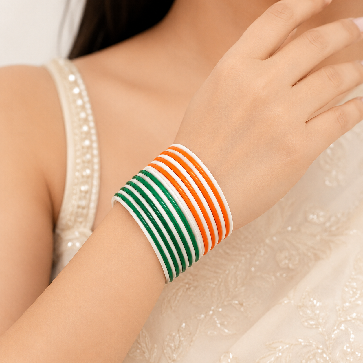 Eternal Tiranga Glossy Metal Bangles by Enava featuring a premium set of 24 glossy aluminum bangles in saffron, white, and green tricolor combination for Independence Day celebrations, patriotic events, cultural programs, festive occasions, and traditional ethnic wear.