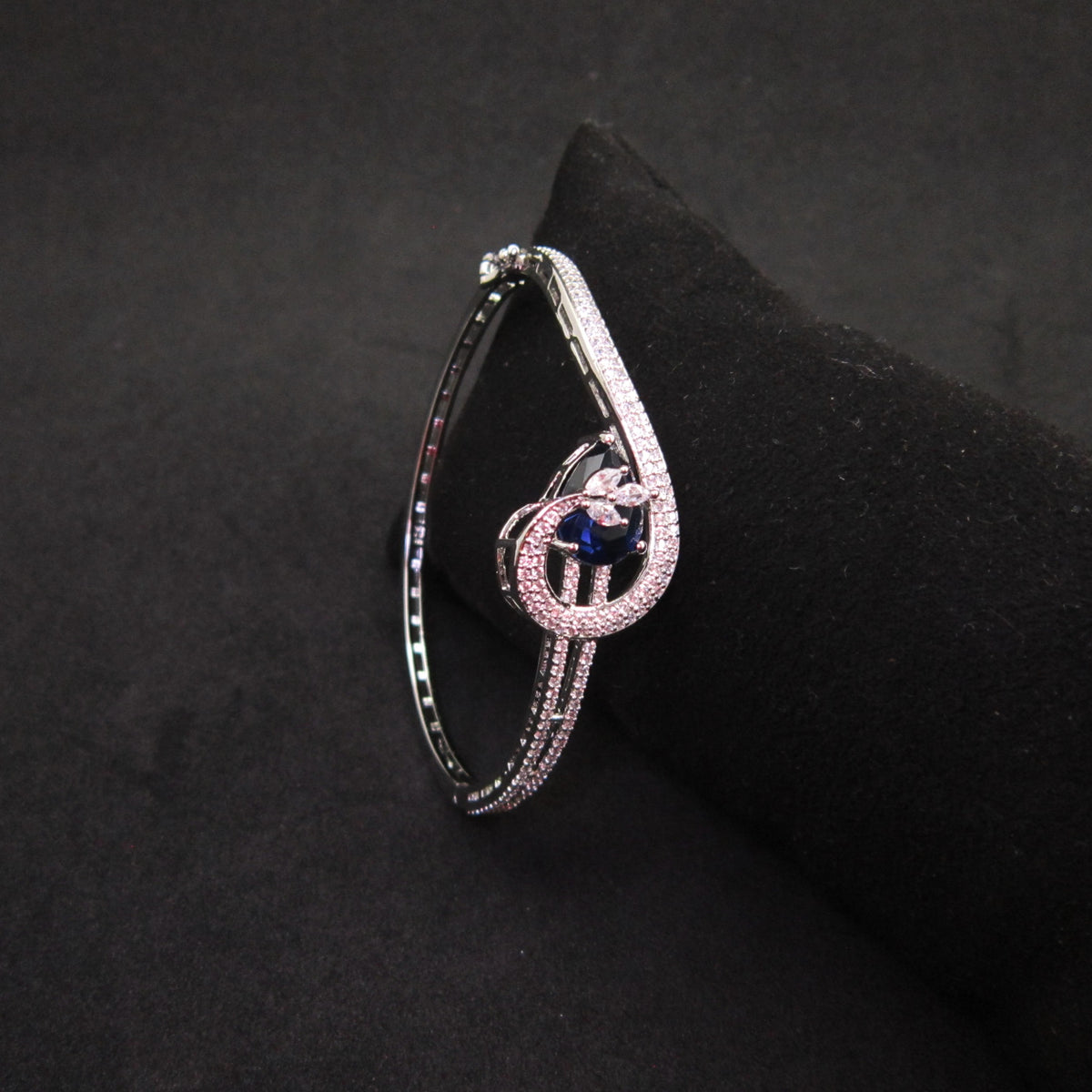 Victorian Blue Diamond AD Bracelet with large blue American Diamond center stone and sparkling AD detailing, elegant royal-inspired designer bracelet for women by ENAVA.