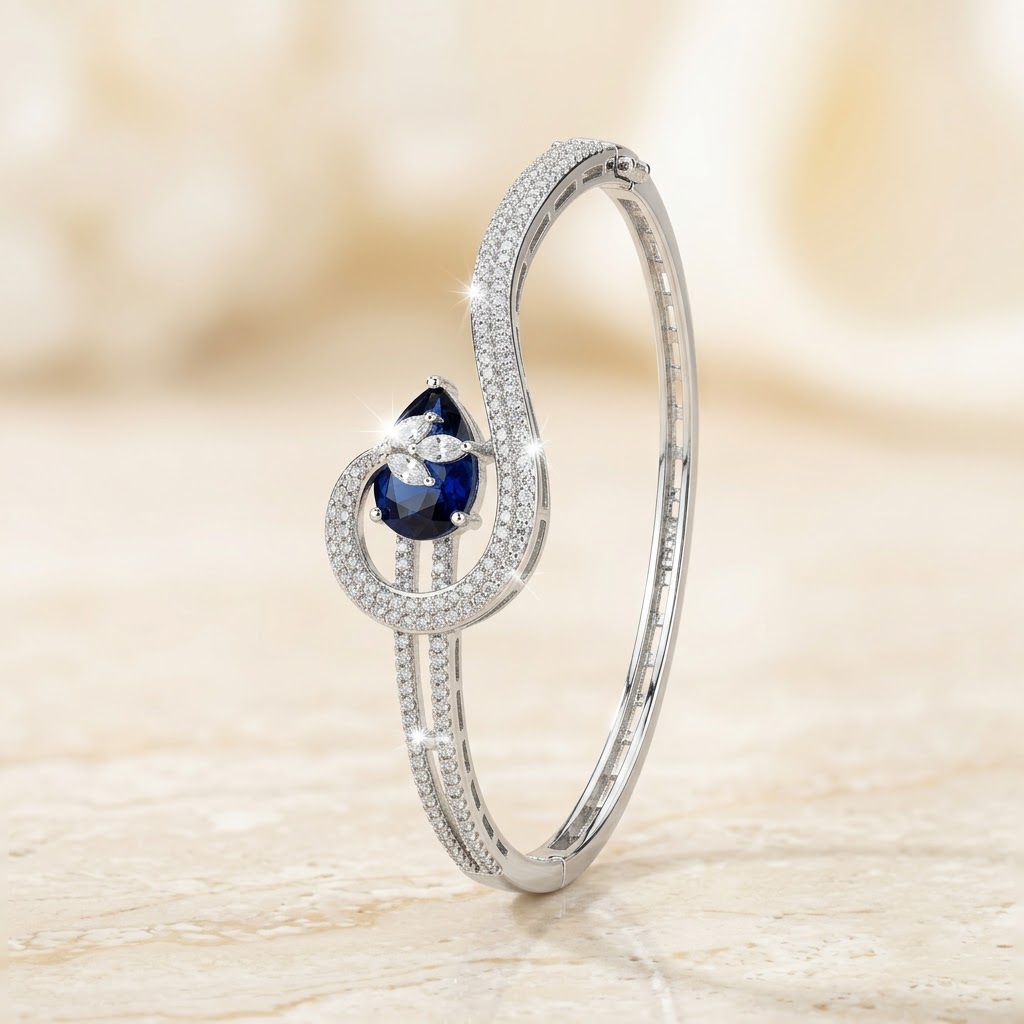 Victorian Blue Diamond AD Bracelet with large blue American Diamond center stone and sparkling AD detailing, elegant royal-inspired designer bracelet for women by ENAVA.